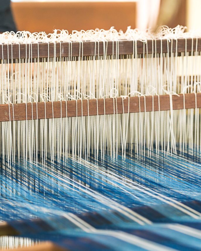 Weave silk cotton on the manual wood loom in Thailand ,The process of silk weaving in the production of Thai silk